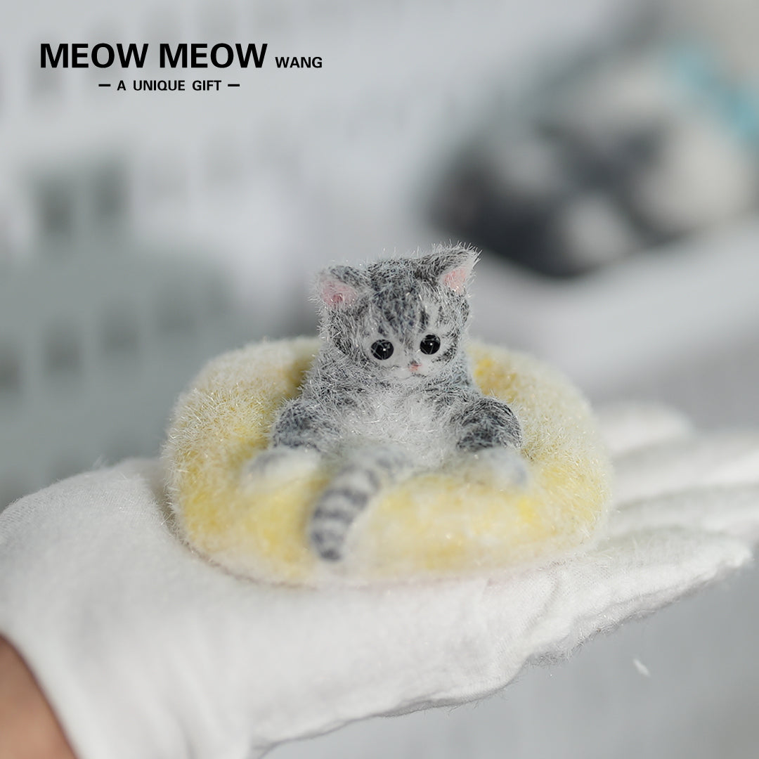 E03:Cute Little Kitten Sitting On A Pillow.