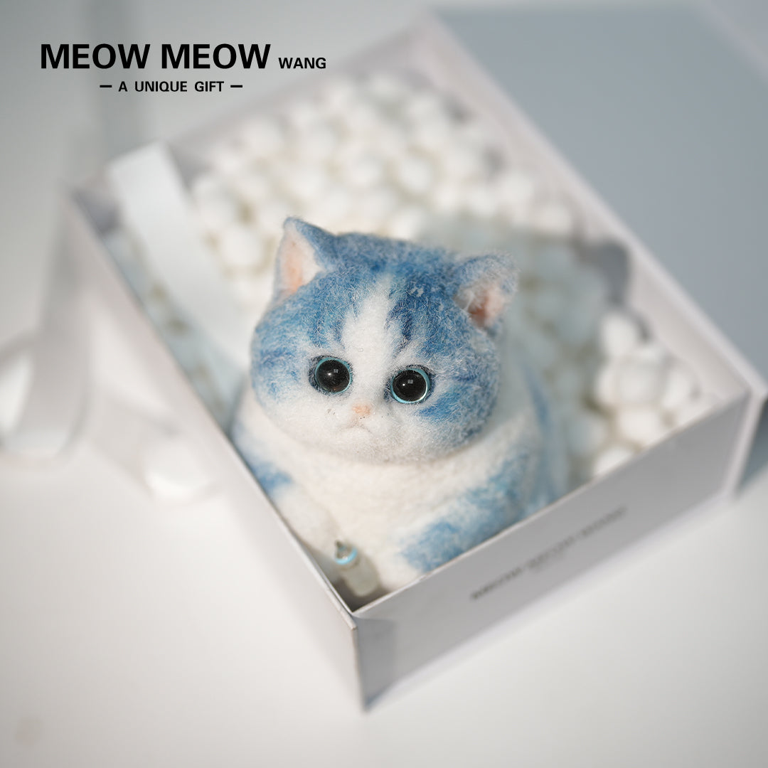 C35:A Blue Kitten Holding A Baby Bottle