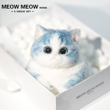 C35:A Blue Kitten Holding A Baby Bottle