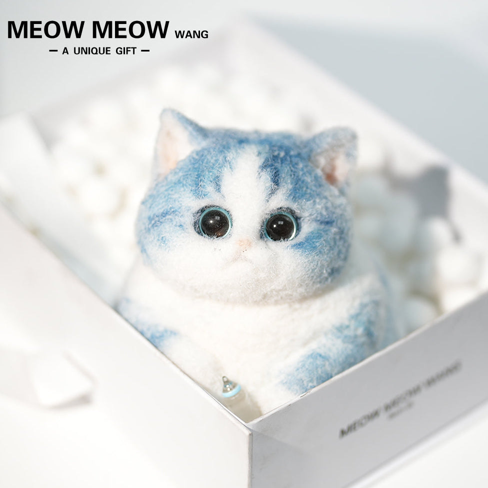 C35:A Blue Kitten Holding A Baby Bottle