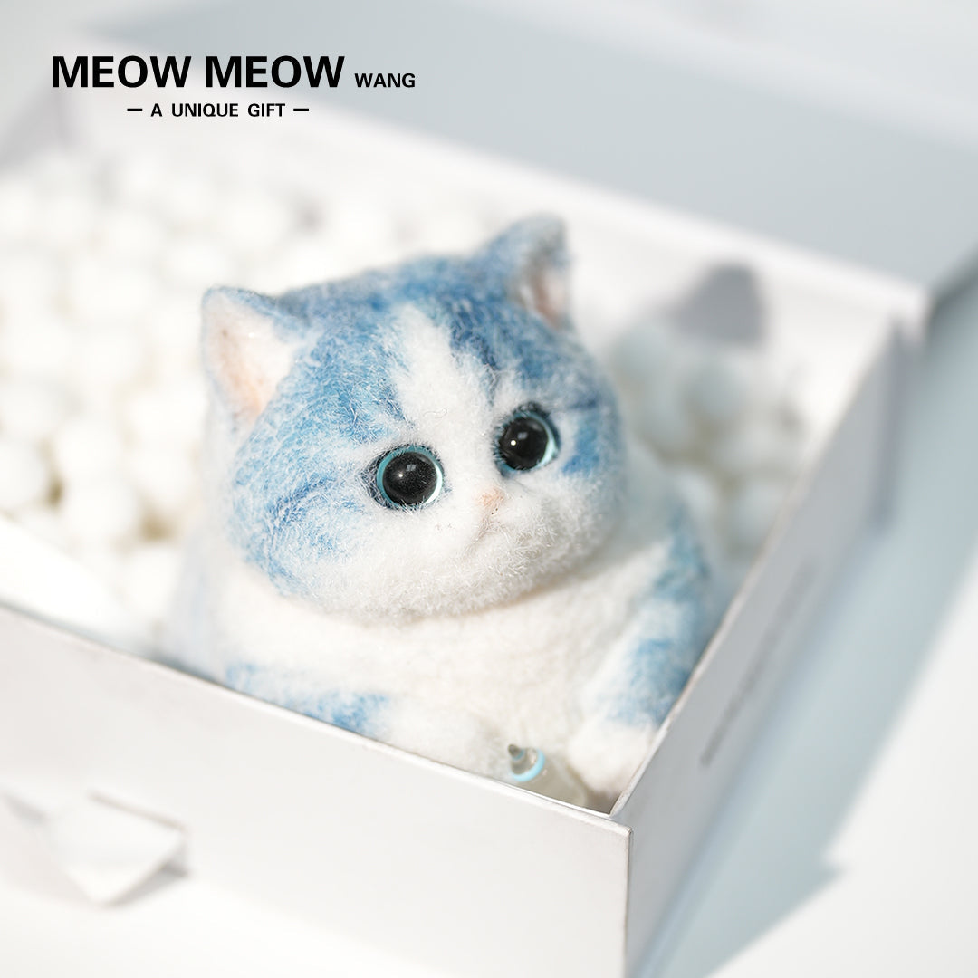 C35:A Blue Kitten Holding A Baby Bottle