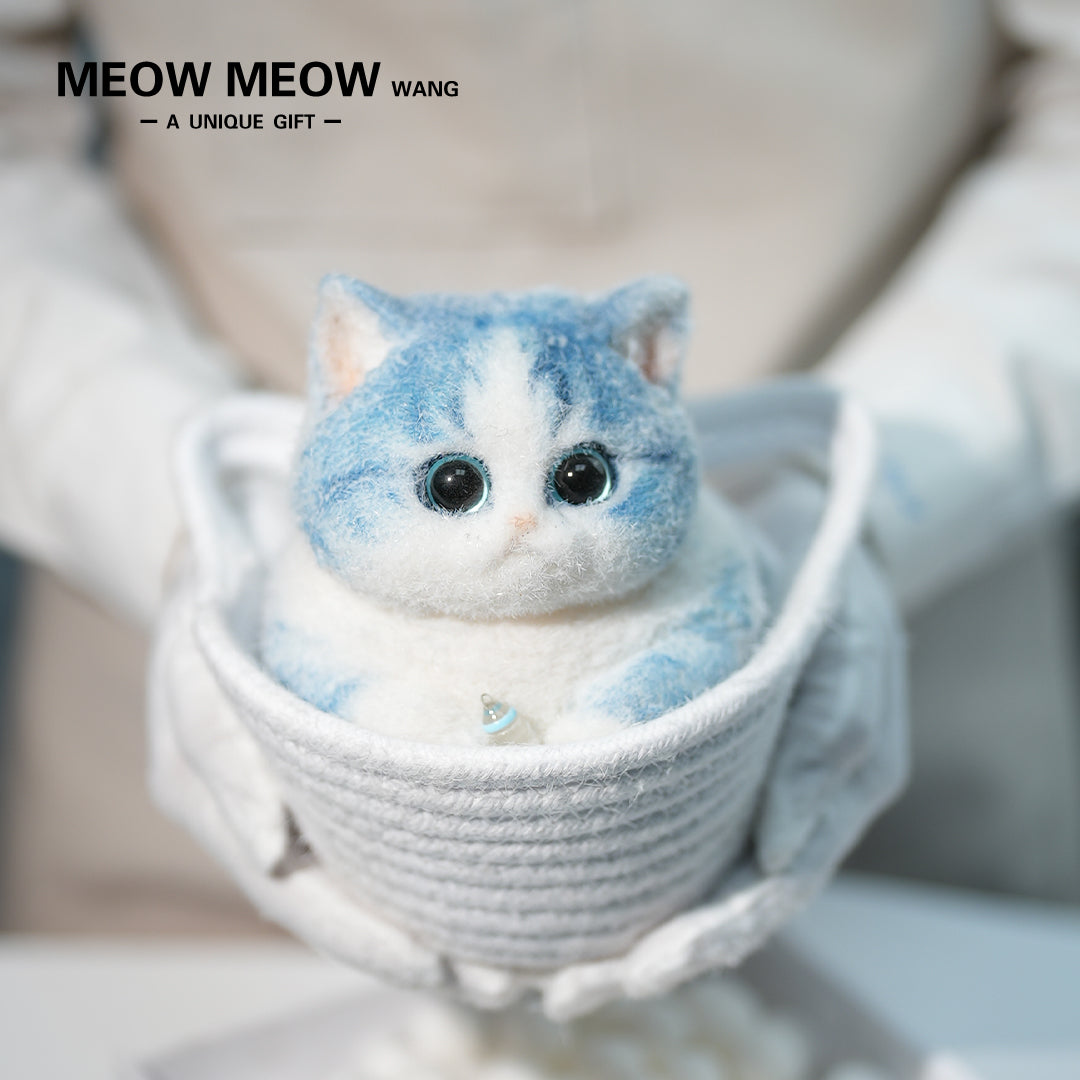 C35:A Blue Kitten Holding A Baby Bottle