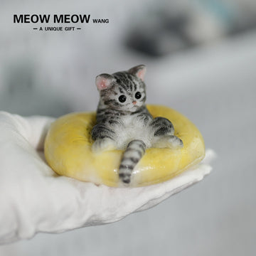 E03:Cute Little Kitten Sitting On A Pillow.