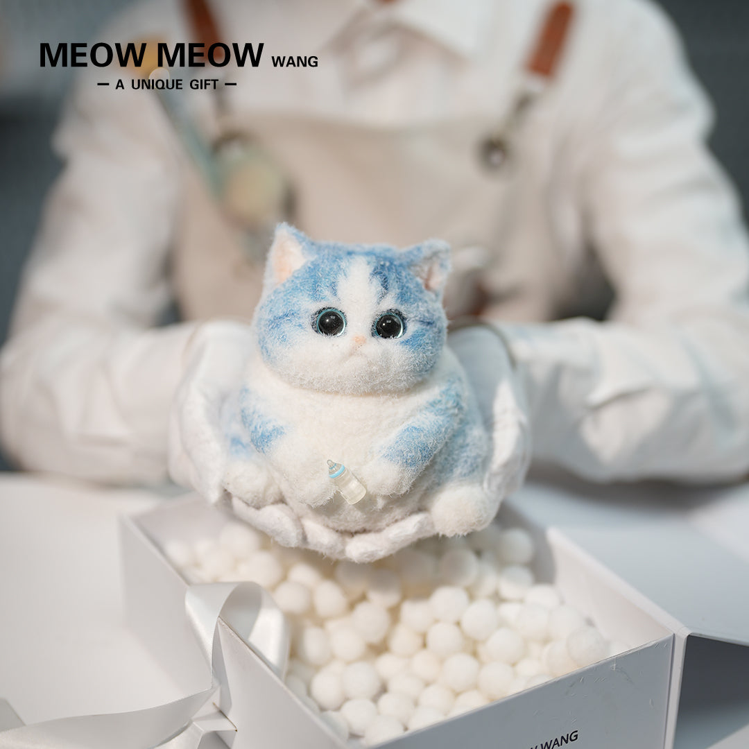 C35:A Blue Kitten Holding A Baby Bottle