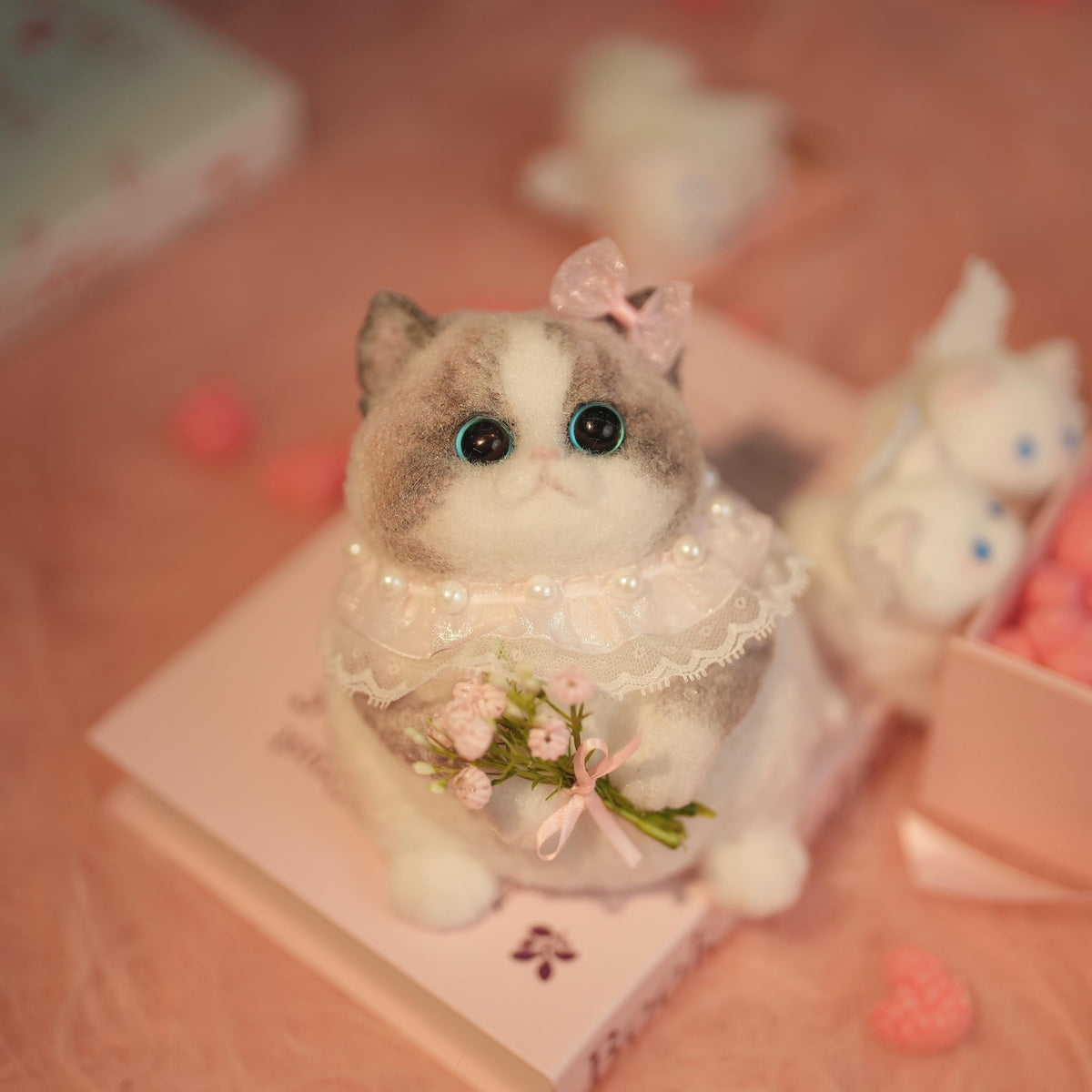 C22:A Chubby Ragdoll Cat Holding Flowers